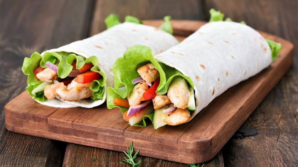 2 wraps with protein rich foods like turkey as filling
