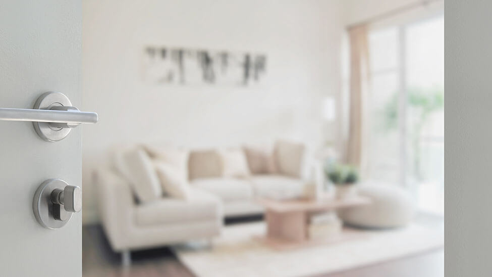 Blurred shot of a living room, which seems to be furnished in a very minimalistic way