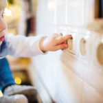 Child sticks finger in socket - dangerous situation