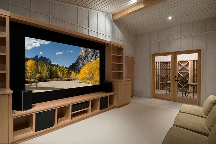 Home theater with large TV in own TV room