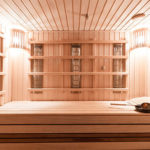 Interior view of a bright, all-wood infrared sauna for the home