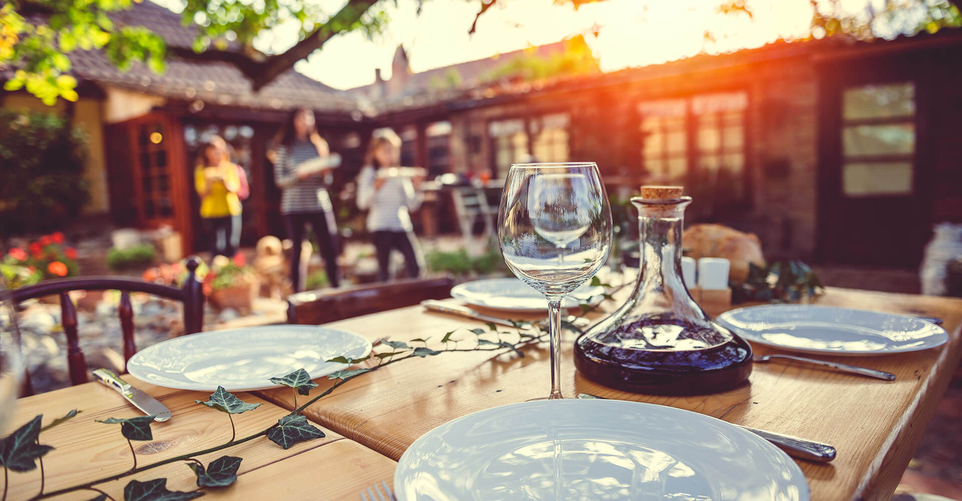 Family sets table for garden party