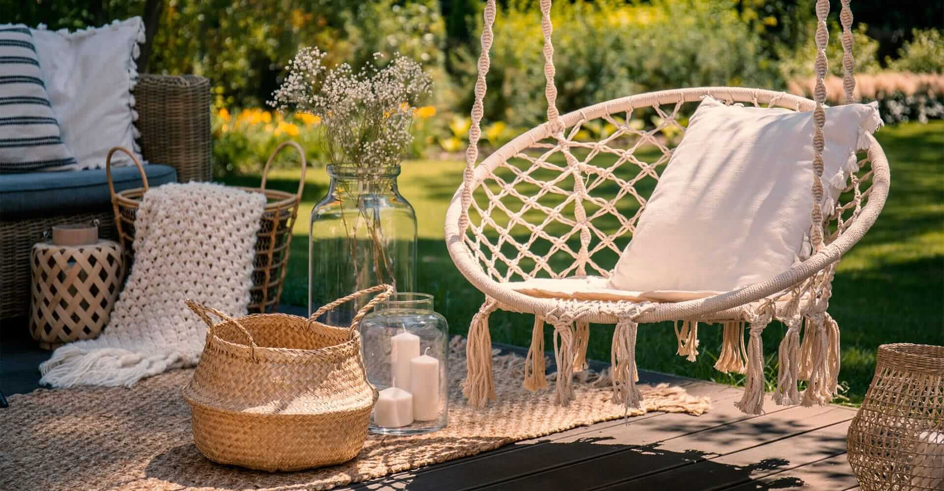 Garden decoration like candles, hanging chair and basket