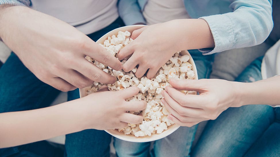 Friends eating homemade popcorn