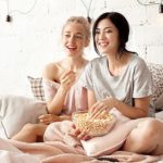 Girlfriends eating homemade popcorn