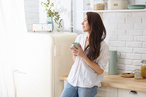 Woman with morning routine drinking coffee