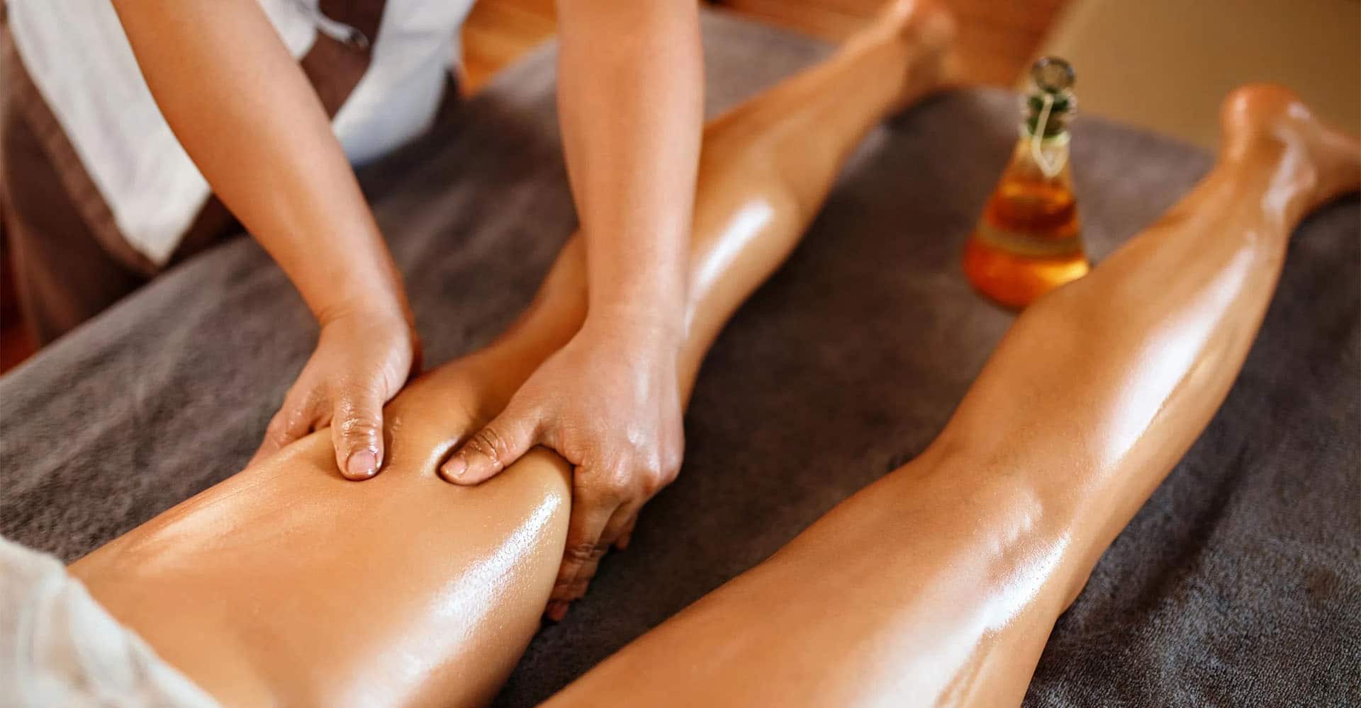 Woman gets Ayurveda massage Abhyanga with oil