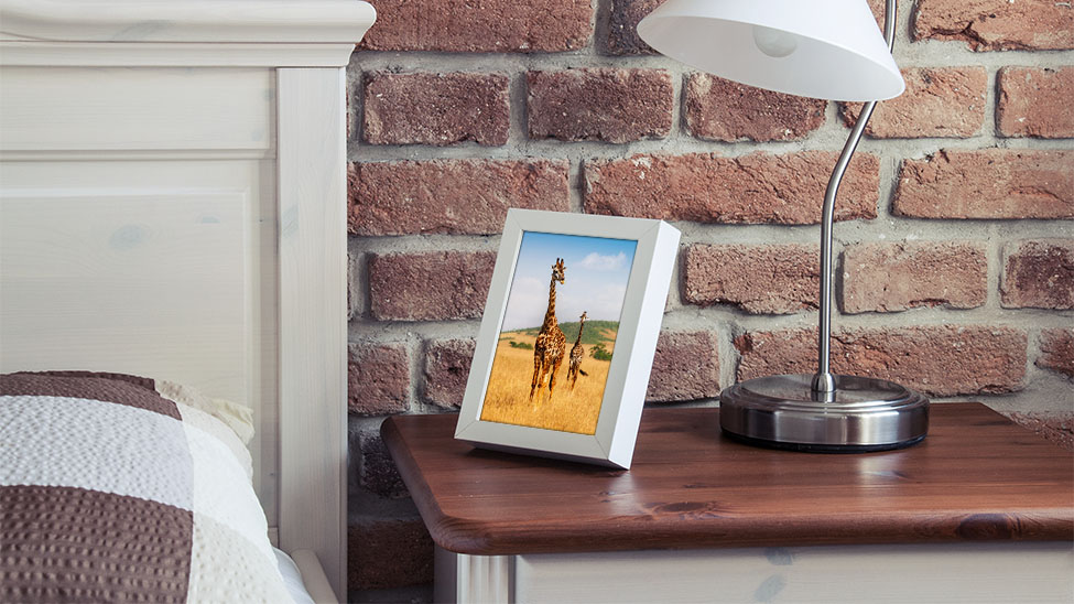 Digital picture frame on bedside table