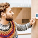 Man adjusts Smart Home heating