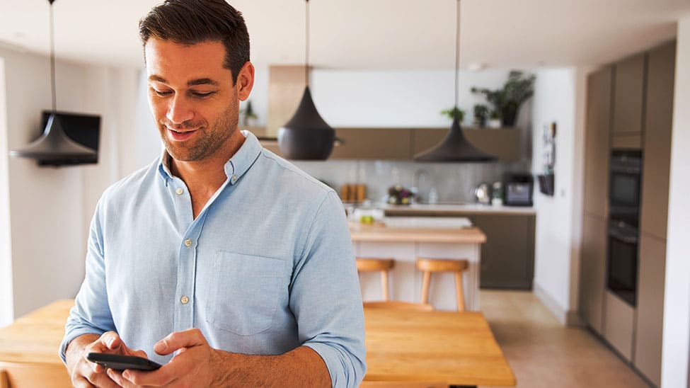 Man controls Smart Home heating with cell phone