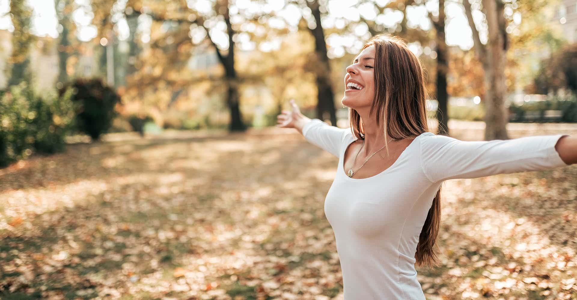 Woman doing breathing exercises outdoors - breathing exercises tips