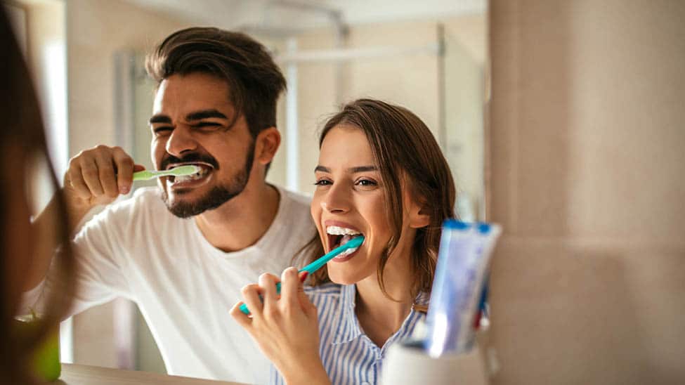 Couple brush teeth together for whiter teeth