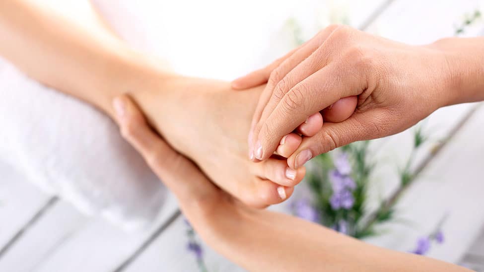 Woman gets foot treatment for nail fungus