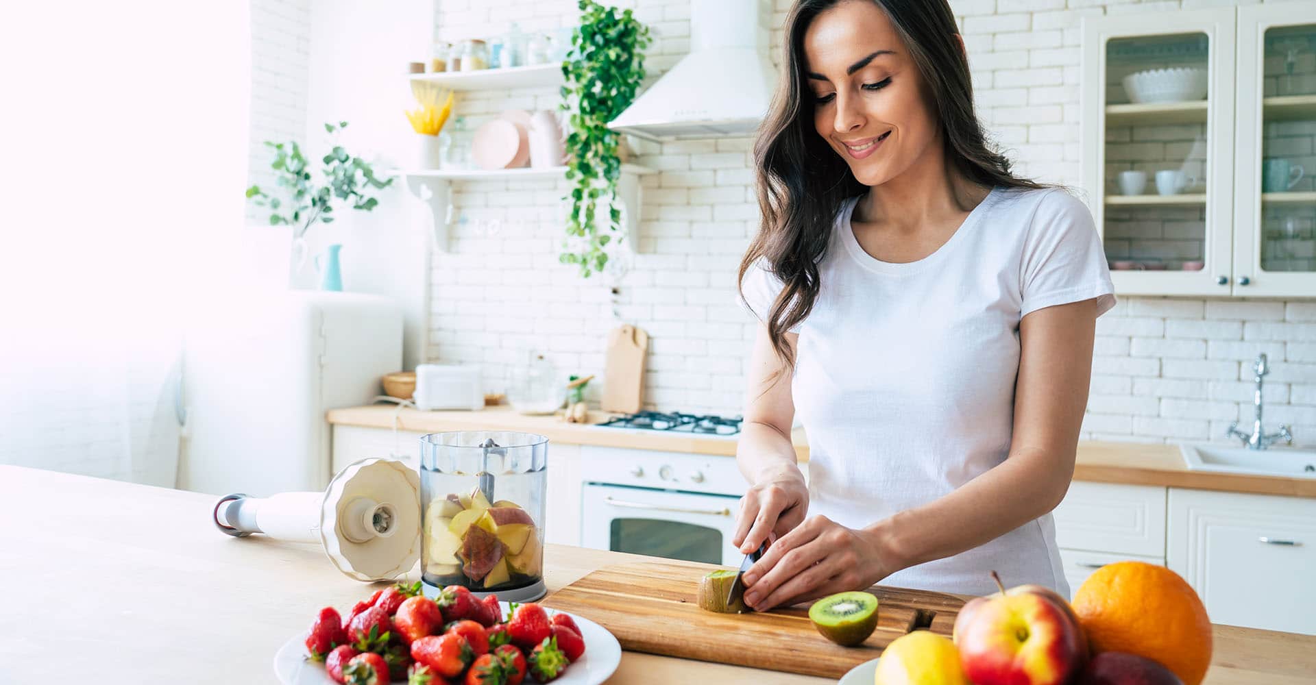 Woman prepares fruit to strengthen her immune system