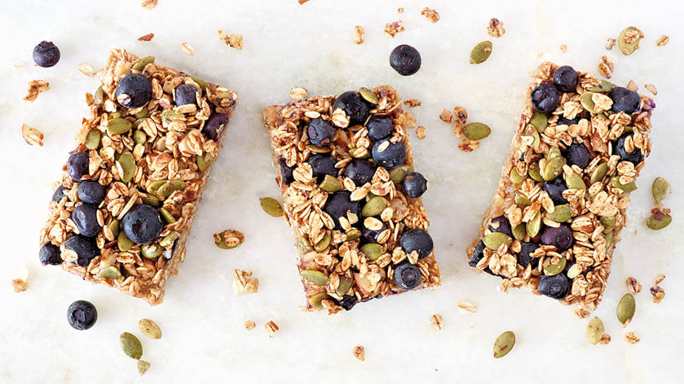 3 granola bars with berries on them as a symbol for eating habit change